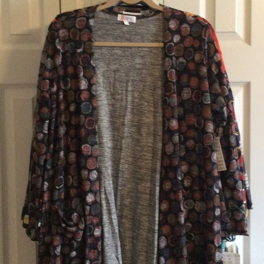 NWT Lularoe Sarah Sweater, size Medium. Circle pattern with rose, blue, green